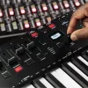 M-Audio Oxygen Pro 49 MIDI-toetsenbordcontroller — 49 toetsen, 16 pads, 9 faders, OLED-display, USB, MIDI-out